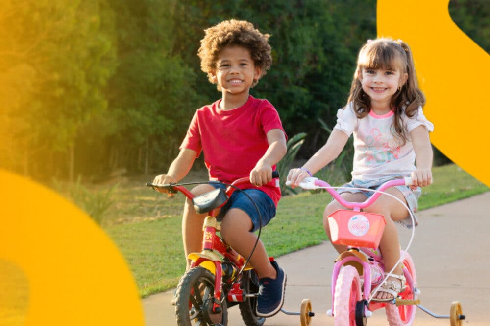 Descubra como escolher a bicicleta infantil ideal para seu filho. O guia completo com tabela de aro e dicas de segurança.